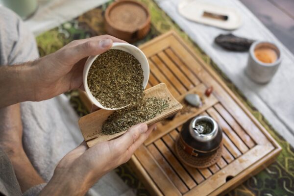 image of a Man preparing yerba mate from a high angle